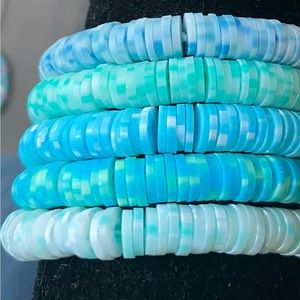 Bracelet set of five blue and green themed.